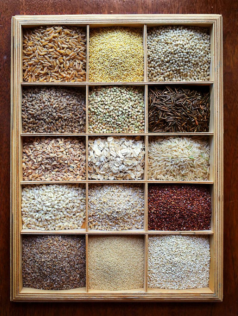 Assorted whole grains: (top row from left) Kamut, millet, sorghum; (second row from left) common red wheat, buckwheat, wild rice; (third row from left) farro, rolled oats, brown rice; (fourth row from left) barley, steel-cut oats, red quinoa; (bottom row from left) bulgur, amaranth, white quinoa 