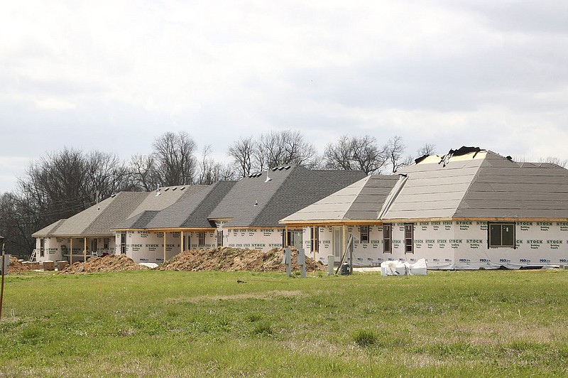 LYNN KUTTER ENTERPRISE-LEADER Many houses are under construction in Sundowner Estates subdivision in Prairie Grove. The photo above shows the back of three houses being built on Capt. Reid Lane.