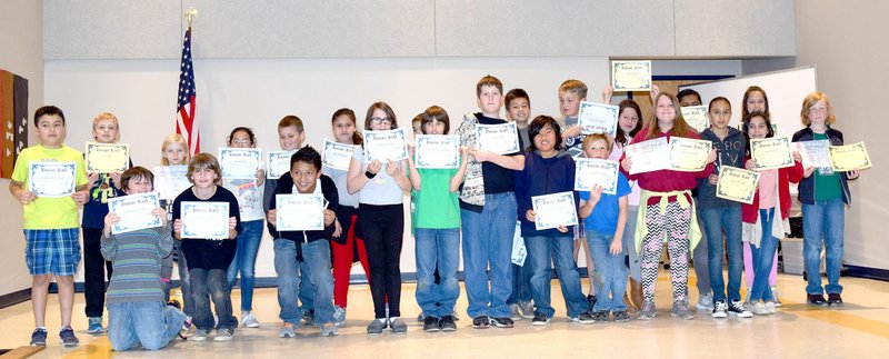 Photo by Mike Eckels Fifth grade students at Decatur Northside Elementary receives their third-quarter honor roll certificates during an assembly in the school cafeteria March 17.