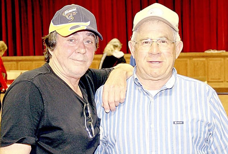 Photo by George Peterson Tom Diepenbrock, left, and Club President Ed Fischer at the Sports Swap.