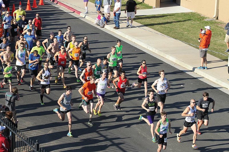 Participants in a past Toad Suck Daze 10K/5K start the race at John McConnell Stadium on the campus of Conway High School. This year’s race will begin at 8 a.m. Saturday. 