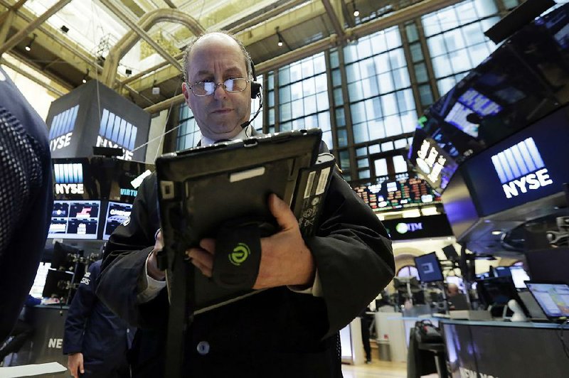 Trader Gordon Charlop works Wednesday on the floor of the New York Stock Exchange.