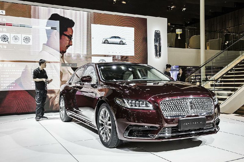 A Ford Motor Co. Lincoln Continental is displayed Tuesday at the Beijing International Automotive Exhibition. Ford on Thursday reported a $2.5 billion first-quarter profit. 