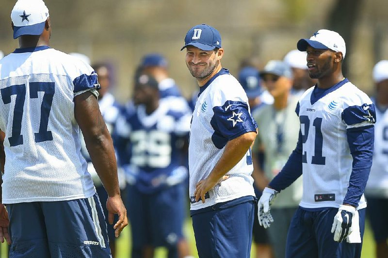 Dallas Cowboys quarterback Tony Romo (9) reacts after a botched drill during Dallas Cowboys' NFL training camp, Thursday, July 30, 2015, in Oxnard, Calif. 

