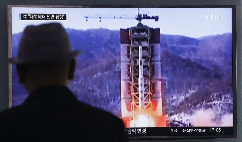 A news program playing Thursday at a railway station in Seoul, South Korea, shows file footage of a rocket launch in North Korea.
