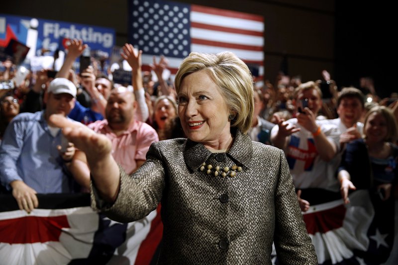 FILE - In this April 26, 2016 file photo, Democratic presidential candidate Hillary Clinton moves to the stage at her presidential primary election night rally in Philadelphia. Bernie Sanders defied expectations to turn his long-shot presidential bid into a real threat for the Democratic nomination. But as his path to the White House becomes all-but-impossible, some of his supporters are lashing out at a system they believe was engineered against them from the start. (AP Photo/Matt Rourke, File)