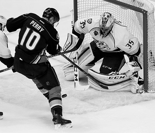 The Associated Press PICK A PEKKA: Nashville Predators goalie Pekka Rinne, right, blocks a shot by Anaheim Ducks right wing Corey Perry during the first period in Game 7 in an NHL first-round playoff series Wednesday in Anaheim, Calif. The Ducks won 2-1 for their first playoff series victory since 2012.