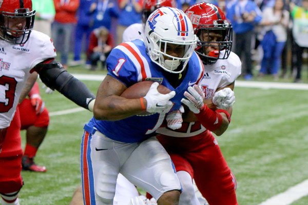Louisiana Tech's Kenneth Dixon (1) runs for a touchdown in the fourth quarter of the Bulldogs' 47-28 win over Arkansas State in the New Orleans Bowl Saturday, Dec. 19, 2015, at the Superdome in New Orleans, La. 