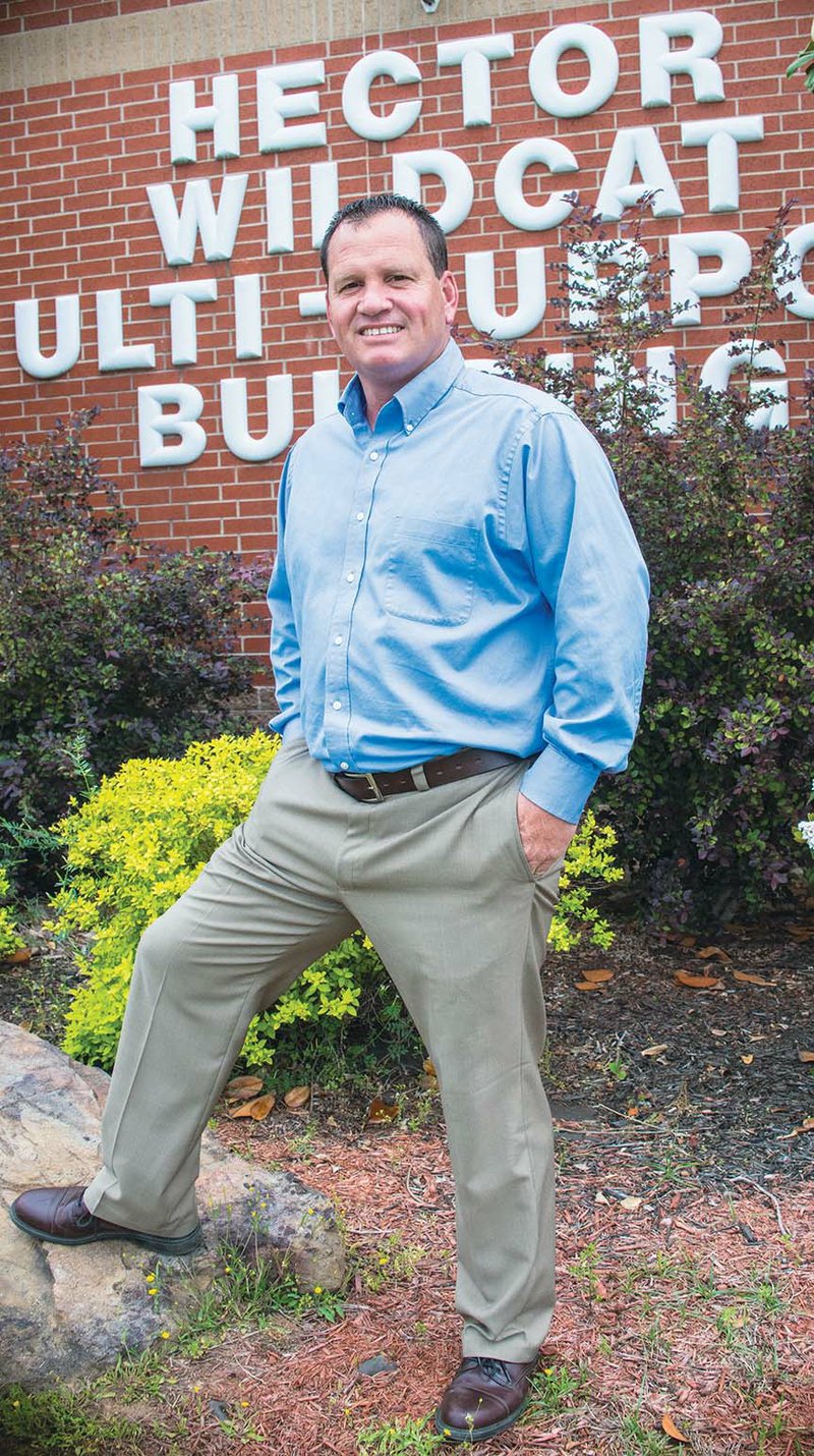 Hector High School Principal Mark Taylor stands in front of a building on campus. He was hired in April as the incoming superintendent for the district to replace Walt Davis, who is taking the top spot in the Perryville School District. Taylor, a graduate of Arkansas Tech University in Russellville, came to Hector four years ago as the football coach and dean of students. “In coaching, you’re worried about your immediate team; in administration, you have to worry about the whole picture,” Taylor said.