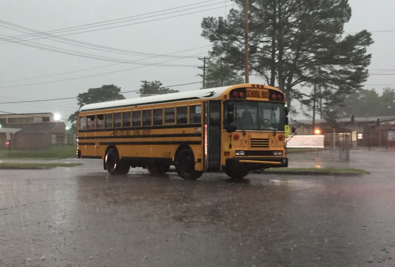 Several students reported injuries after a car crashed into this North Little Rock School District bus Friday morning.