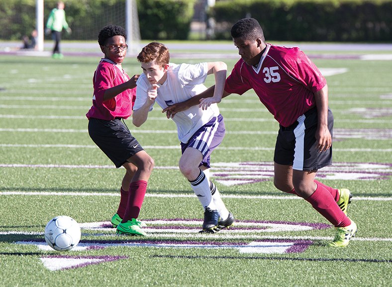 News-Times/Faith Lightsy Pine Bluff's Montrey Turner (left) along with teammate Tylor Johnson (right)  attempts to slow down  El Dorado's Jake Lowrey during a 6A-South contest Thursday at Memorial Stadium. 