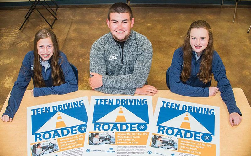 Megan Lewis, left, 14, Zac Brogdon, 18, and Kristen Sherrill, 14, display the posters they are using to promote the Teen Driving Roadeo event to take place Saturday in Batesville.