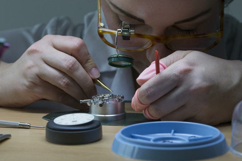 A watchmaker assembles a Senator Chronograph Panorama Date luxury piece at the Glashuette Original factory in Glashuette, Germany. 