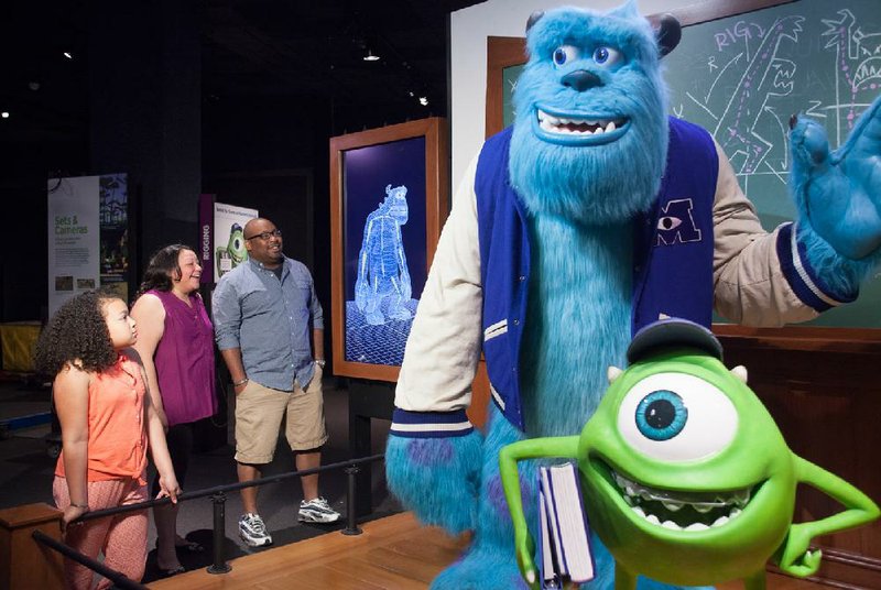 Monsters, Inc.’s Sulley (left) and Mike await visitors at The Franklin Institute’s “The Science Behind Pixar” exhibition. 