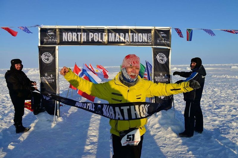 Dorn Wenninger, vice president of global food sourcing in Latin America at Wal-Mart Stores Inc., is the first to cross the finish line at the North Pole Marathon in April. 