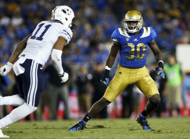 Linebacker Myles Jack (right) might have to sit out this season because of a knee injury, but the former UCLA standout was still drafted by Jacksonville in the second round with the 36th overall pick.