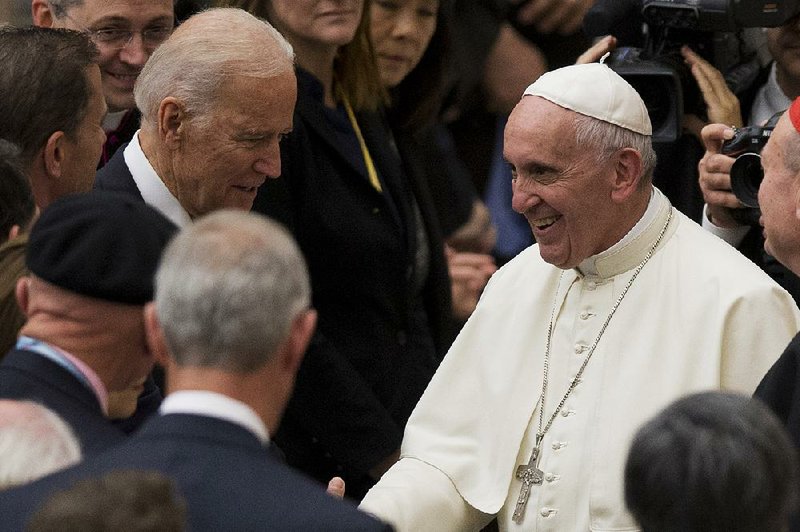 Pope Francis greets Vice President Joe Biden during Friday’s Vatican conference on medical research.