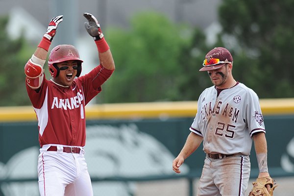 Arkansas second baseman Rick Nomura celebrates a two-run RBI double against Texas A&M Saturday, April 30, 2016, during the second inning at Baum Stadium in Fayetteville. 