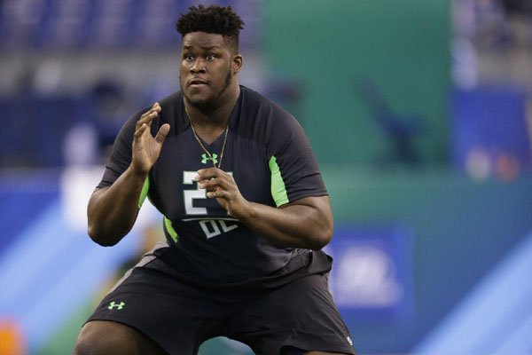 Arkansas offensive lineman Denver Kirkland runs a drill at the NFL football scouting combine in Indianapolis, Friday, Feb. 26, 2016. (AP Photo/Michael Conroy)