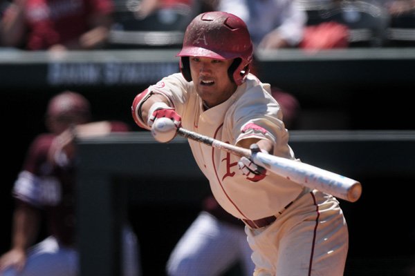 Arkansas second baseman Rick Nomura bunts out in the fourth inning against Texas A&M on Sunday, May 1, 2016, during the game in Baum Stadium in Fayetteville.