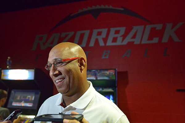 Arkansas receivers coach Michael Smith answers questions during the Razorbacks' annual media day on Sunday, Aug. 9, 2015, at Fred W. Smith Center in Fayetteville. 