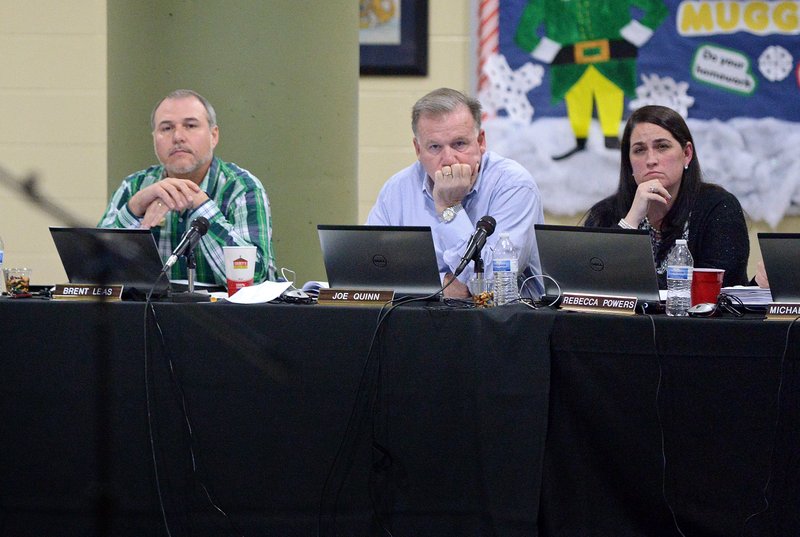 Brent Leas, left, with fellow Bentonville School Board members Joe Quinn and Rebecca Powers in a 2015 file photo.