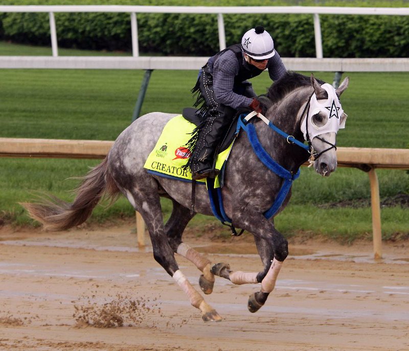 Exercise rider Carlos Rosas takes 2016 Arkansas Derby winner Creator around the Churchill Downs track during a workout Monday in Louisville, Ky., in preparation for Saturday’s Kentucky Derby.