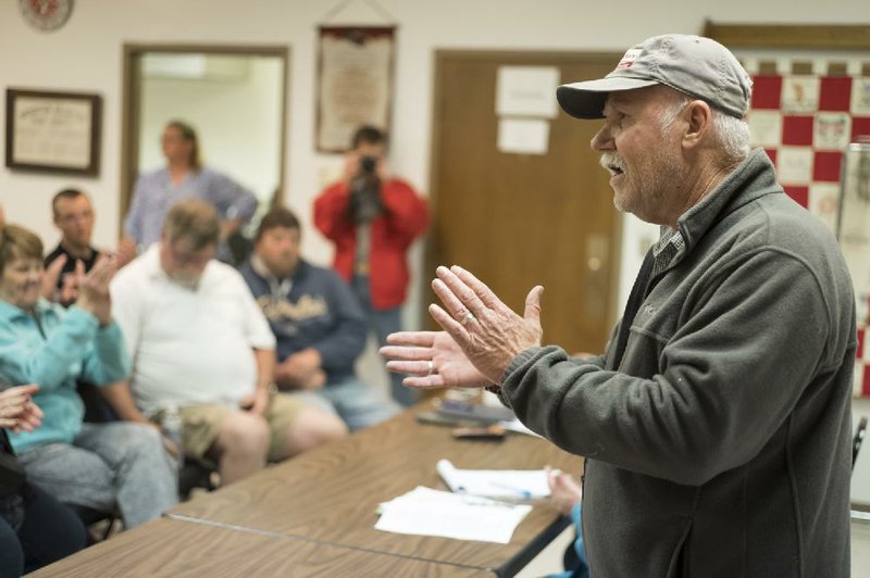 Randy Ruppert talks residents of Nickerson, Neb., at a meeting on April 19 about a plan to open a chicken processing plant in the town, which Ruppert opposes.
