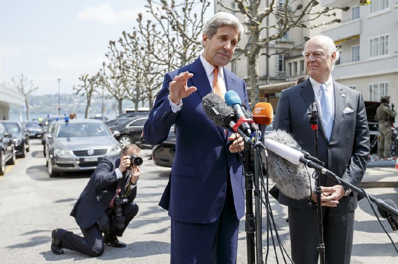 U.S. Secretary of State John Kerry (left) and the United Nations Special Envoy for Syria Staffan de Mistura speak to the media Monday during a news briefing after their meeting on Syria in Geneva.