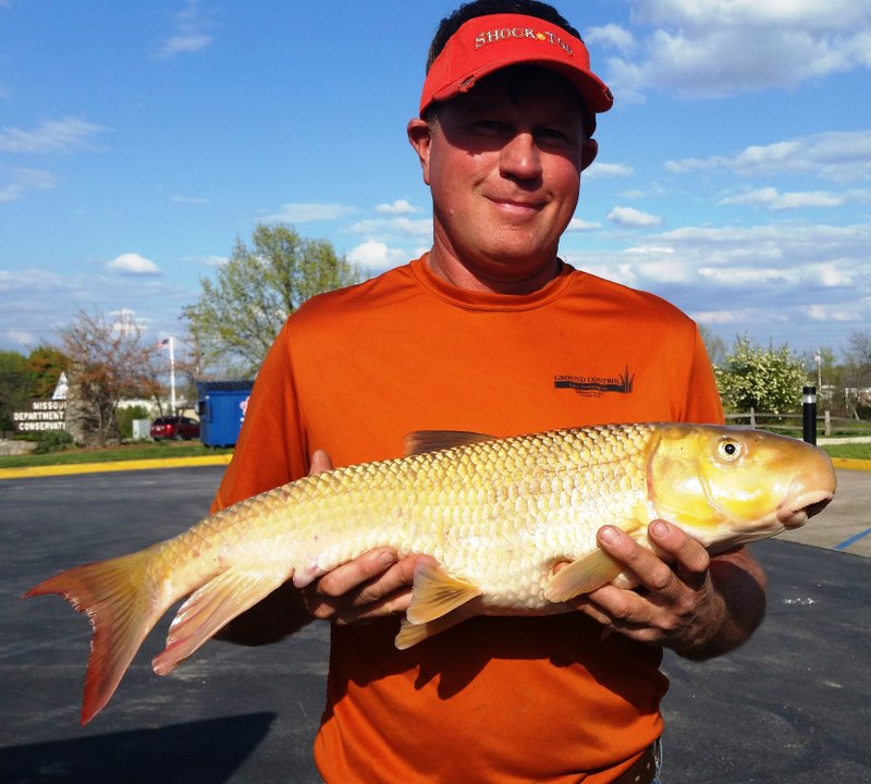 Dan Schmitz of Jefferson City, Mo., shows his Missouri state record redhorse sucker.