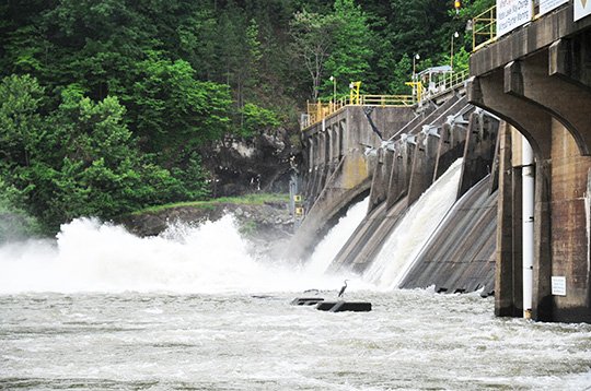 The Sentinel-Record/Mara Kuhn REMMEL DAM: Entergy Arkansas Inc. continued to release water through the spillway gates at Remmel Dam into the Ouachita River on Monday after heavy weekend rains raised Lake Ouachita, located upstream of the dam, into the flood pool. Releases from Blakely Mountain Dam, which forms Ouachita, have to be done in conjunction with releases from Remmel and Carpenter Dam, which forms Lake Hamilton.