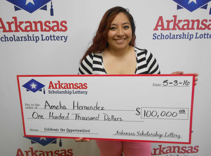 Amelia Hernandez poses with an oversized check in this photo released by the Arkansas Scholarship Lottery.