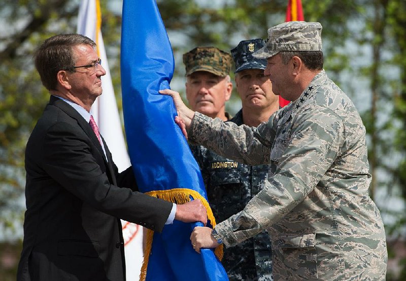 Defense Secretary Ashton Carter accepts the rank pennant from Air Force Gen. Philip Breedlove during a change of command ceremony Tuesday at the United States European Command in Stuttgart, Germany.