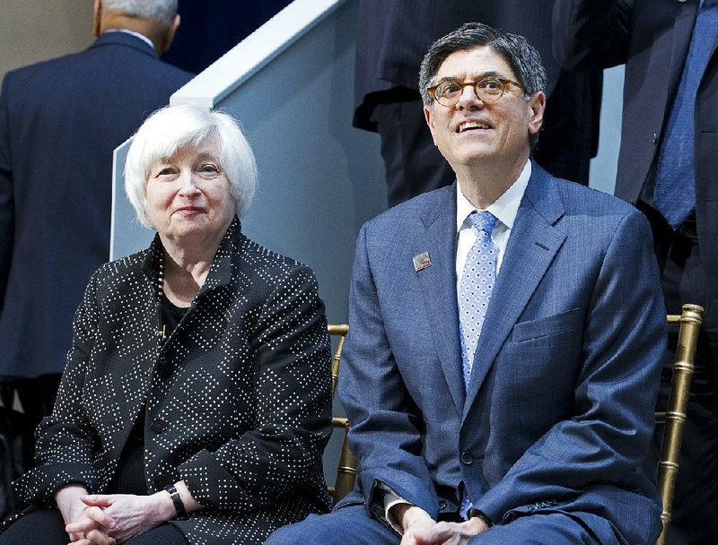 Federal Reserve Chair Janet Yellen and Treasury Secretary Jacob Lew at the G-20 Finance Minister and Central Bank Governors group photo, during the World Bank/IMF Spring Meetings at IMF headquarters in Washington, Friday, April 15, 2016. 