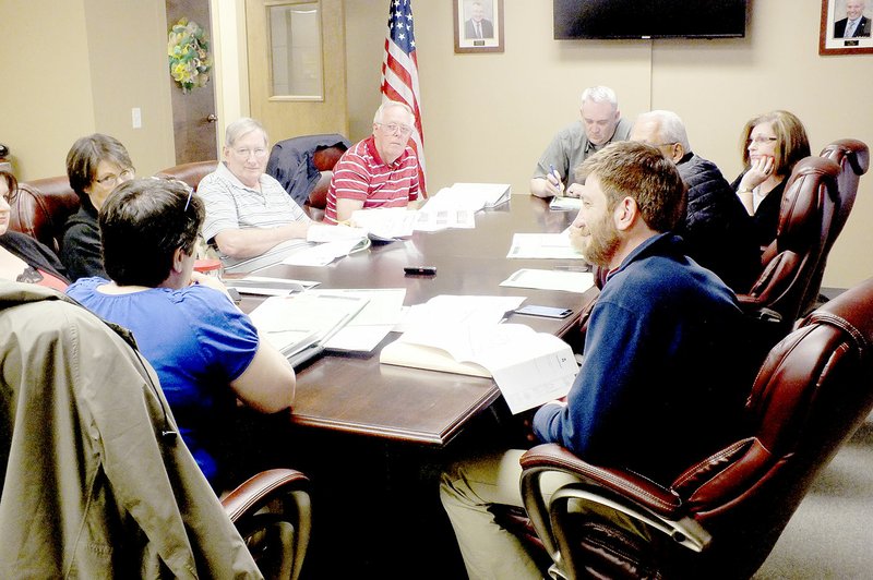 Conor Woody/The Weekly Vista Members of the Bella Vista Planning Commission discuss an issue during their meeting last week.