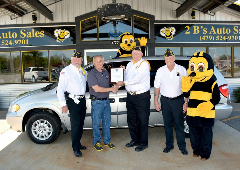 Janelle Jessen/Herald-Leader Dennis Bergthold, owner of 2B&#8217;s Auto, donated a minivan to the American Legion Honor Guard. Also pictured, from left, are honor guard members Jim Gillig, J.W. Smith and Chuck Lankford. The van will be used to transport members of the guard and their equipment to funerals and events.