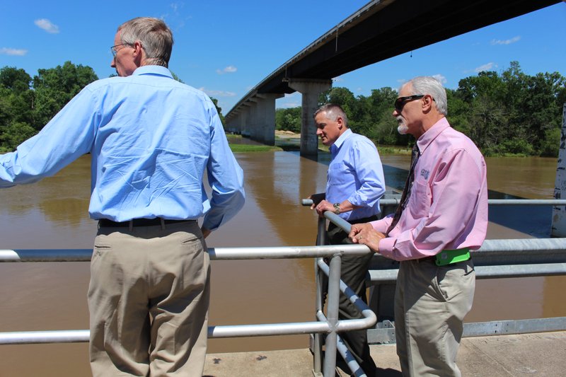 Union County Water Conservation Board President Robert Reynolds, from left, U.S. Rep. Bruce Westerman of Hot Springs (R-4th District) and senior engineer Chuck Campbell of CBMc & Associates visit the Ouachita River Alternative Water Supply Project water treatment plant and pump station on the Ouachita River near Calion on Wednesday. Westerman was in El Dorado to tour the Union County Water Conservation Program and the Arkansas Shortline Railroad. He also met with students at Camden's Fairview High School earlier in the day.