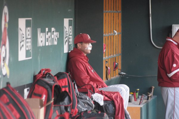 Arkansas assistant coach Tony Vitello sits in the dugout during a game against Missouri State on Tuesday, May 3, 2016, at Hammons Field in Springfield, Mo.