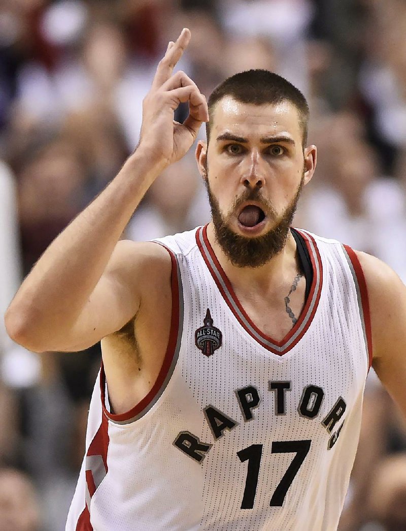 Jonas Valanciunas of the Toronto Raptors reacts after scoring in overtime during Thursday night’s game against the Miami Heat.