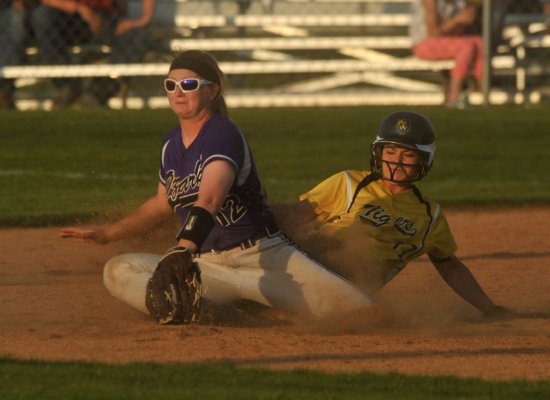 Prairie Grove’s Madison Beaver (17) slides into second base as Ozark’s Chelsea Haney (12) tries to make the tag Thursday during the 4A North Regional Tournament in Prairie Grove.