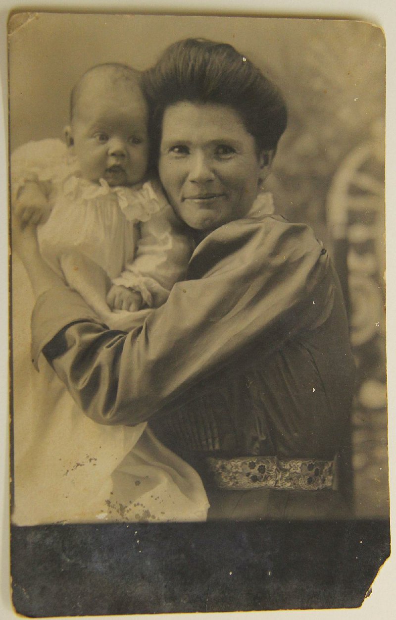 Gayne Preller holds a baby in this undated photo taken by her husband, Hugo Preller.