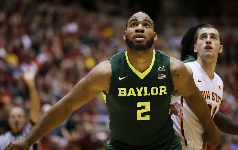 In this Jan. 9, 2016, file photo, Baylor forward Rico Gathers (2) and Iowa State guard Matt Thomas, right, wait for a rebound during an NCAA college basketball game in Ames, Iowa.  