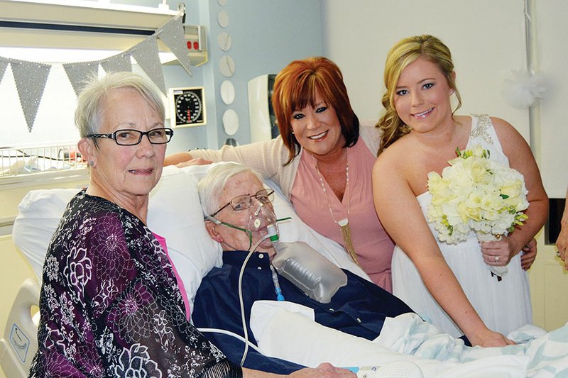 Bride Abigail Bonds of Clinton stands with her mother, Susan Lee-Ward, and grandparents, Marylou Lee and Joe Lee Sr., who died April 17. Bonds held her wedding in her grandfather’s coronary-care-unit room at Baptist Health Medical Center-Little Rock when she realized he wouldn’t be able to attend her wedding in June.