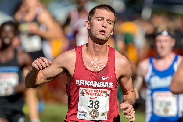 Arkansas junior Cale Wallace runs in the collegiate 8K on Saturday, Oct. 4, 2014, during the 26th annual Chile Pepper Cross Country Festival at Agri Park in Fayetteville. 