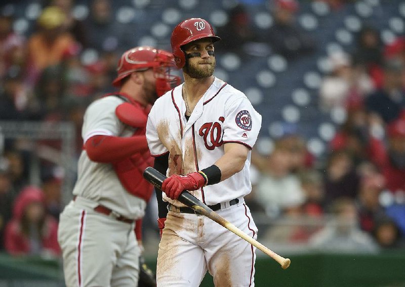Washington Nationals' Bryce Harper reacts after he struck out during the fourth inning of a baseball game against the Philadelphia Phillies, Thursday, April 28, 2016, in Washington. The Phillies won 3-0.