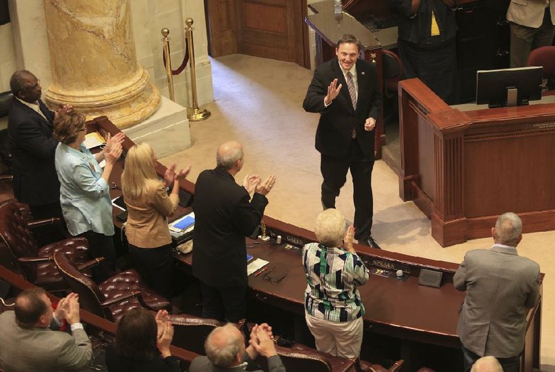 Representatives applaud Monday morning as House Speaker Jeremy Gillam, R-Judsonia, walks onto the House floor after being elected speaker designate for the next General Assembly. Only four others have served two terms as Arkansas speaker.