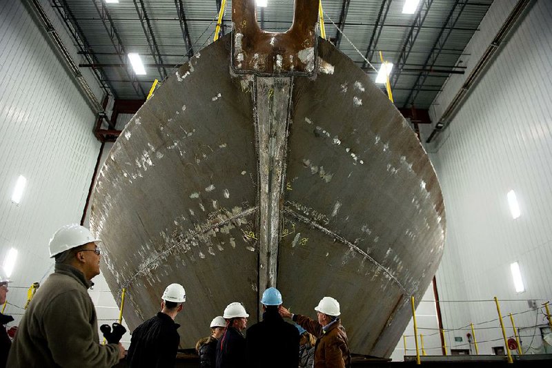 A hull for a U.S. Navy littoral combat ship sits in a paint booth at Marinette, Wis., in this file photo. 