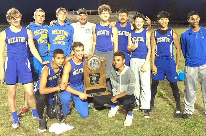 Submitted Photo Members of the Decatur High School boys&#8217; track team displayed the team&#8217;s runner-up trophy after placing second in the 2A state track meet in England (Ark.) on May 2. Members of the team included Jimmy Mendoza (front, left), Tyler Riddle, Alex Morrow, Taylor Haisman (back, left), Brandon Coker, Bracy Owens, Coach Shane Holland, Ryan Shaffer, Marck Guadarrama, Cayden Bingham, Leng Lee and Tajae White.