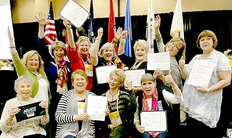 Photo submitted Members of Bentonville/Bella Vista Club celebrate after winning awards in six of the nine categories during the District Eight conference of Altrusa International. The conference was held in Bentonville April 21-23.