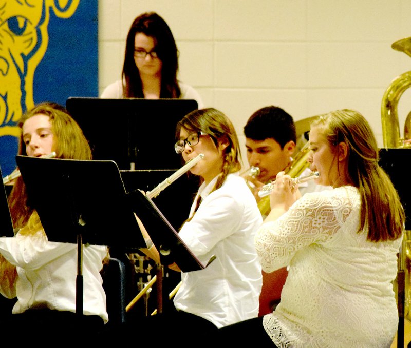 Photo by Mike Eckels Members of the high school band perform music by Swearingen, Barrett, and Fillmore during the spring concert in the cafeteria of Decatur High School May 5. Members include: Samantha Skaggs (left), Shaney Lee, Kaitlyn Smith, Jafett Puga and Alisun Watson.